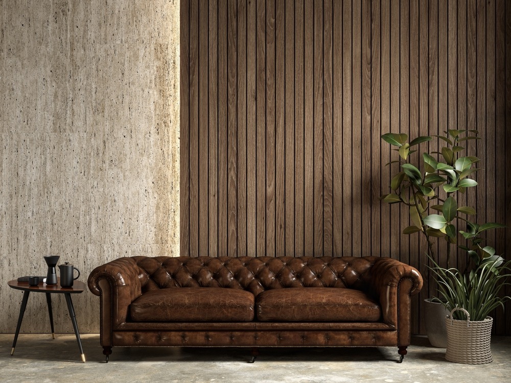 Interior,With,Brown,Leather,Chester,Sofa,,Stone,Wood,Wall,Panel,